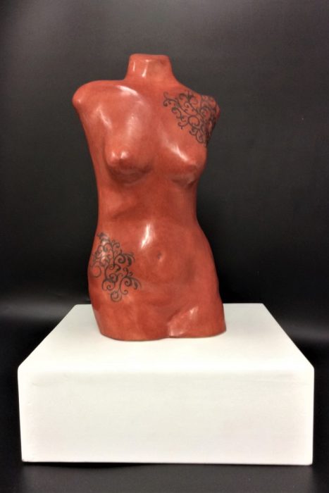 red iron oxide slip-cast torso in earthenware